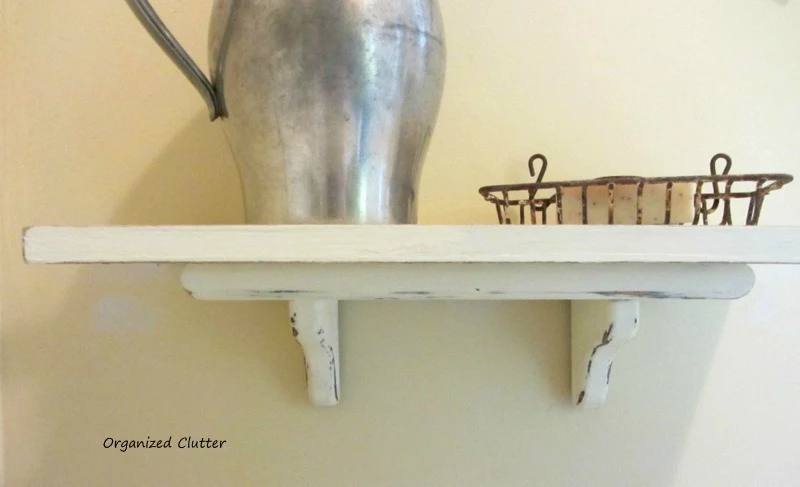 Adding a Shutter to a Thrift Shop Shelf www.organizedclutterqueen.blogspot.com