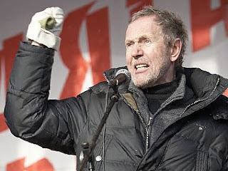 Valery Trapeznikov at a rally wearing his trademark gloves