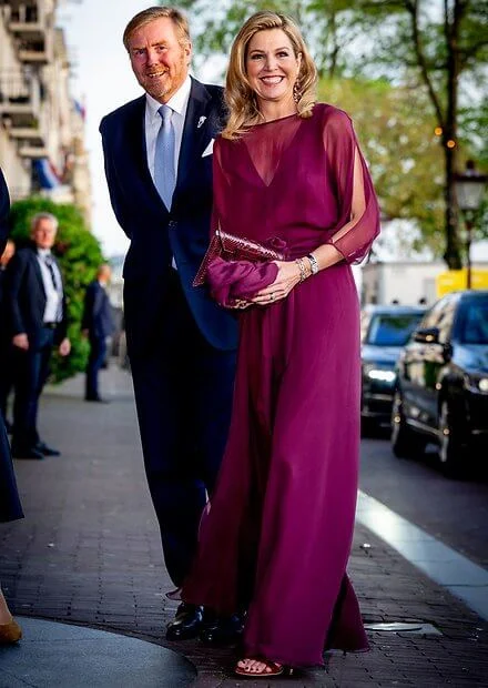 Queen Maxima wore a new burgundy Odirc silk muslin top, and Oscar pareo trousers by Natan Couture. Natan Couture SS24 collection
