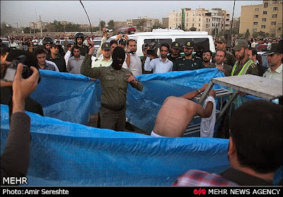 Flogging of a convict prior to his public execution in Karaj, Iran, in Aug. 2015