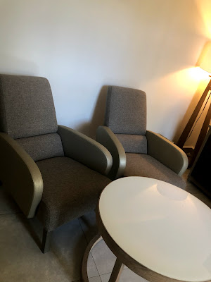 Two upholstered chairs with a low table