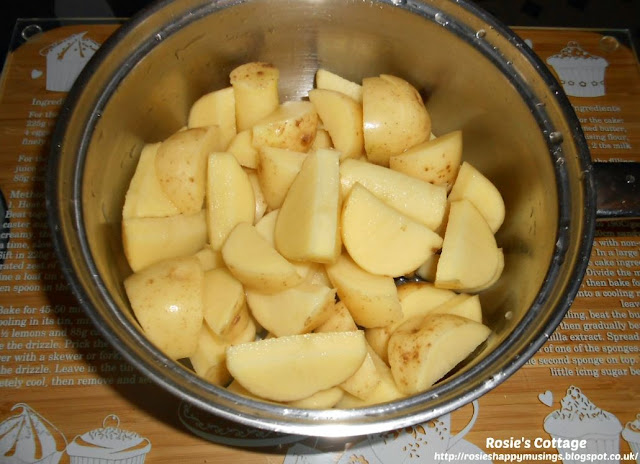 Easiest Ever Homemade Potato Wedges: Place the potato wedges into a saucepan and rinse thoroughly in cold water.