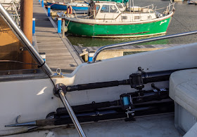Photo of rods and boat hook neatly stowed away in their newly fitted pipes