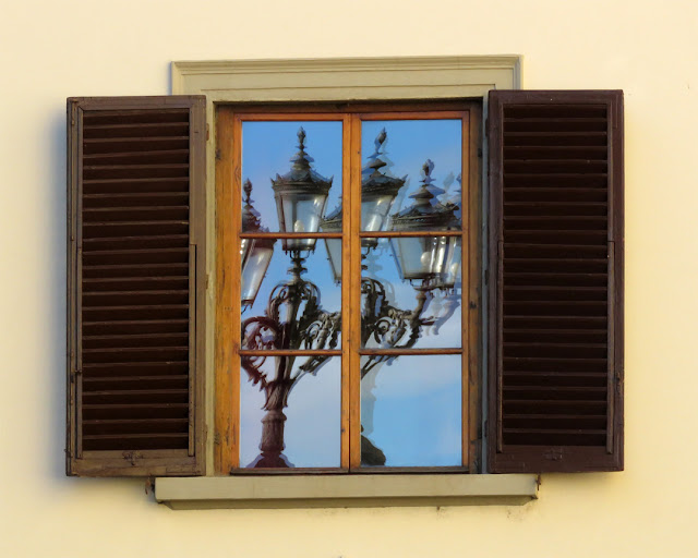 Lamp post reflected in a window, Piazza de' Pitti, Florence