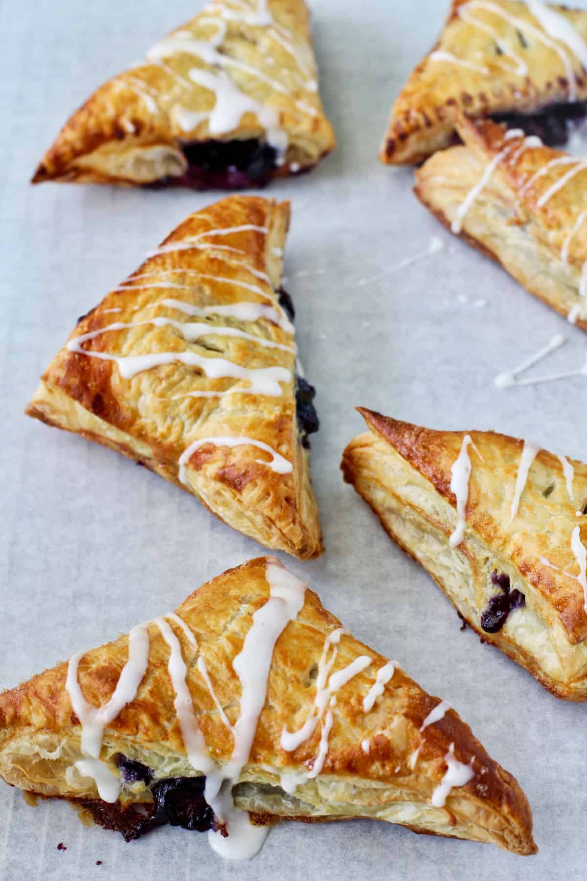 Blueberries and Lemon Mascarpone Turnovers on a baking sheet.