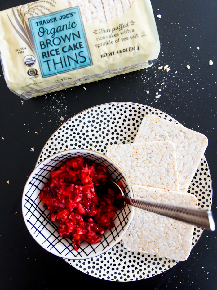 Trader Joe's Organic Brown Rice Cake Thins on polka dot plate with cranberry relish in bowl