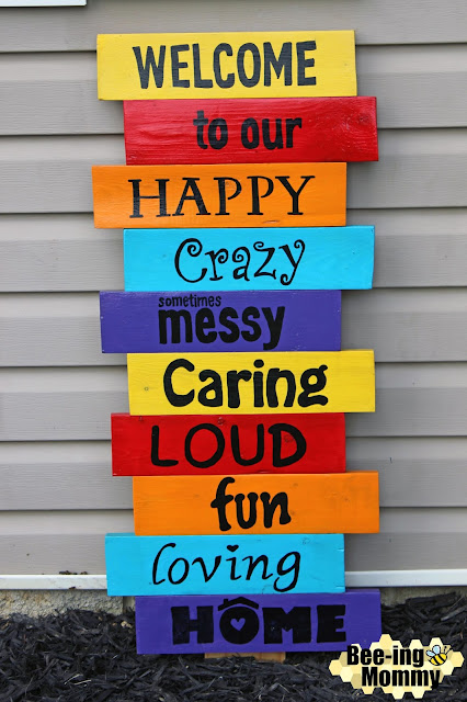 pallet welcome sign, colorful pallet welcome sign, welcome sign, flower bed sign, DIY pallet welcome sign, DIY welcome sign, welcome to our happy crazy messy caring loud fun loving home, our happy crazy messy caring loud fun loving home, welcome to our home, welcome to our crazy fun loving home, welcome to our crazy fun loving home sign, pallet crafts, pallet signs, homemade sign, homemade welcome sign, welcome, colorful welcome sign, fun welcome sign, funny welcome sign, welcome sign tutorial, tutorial, pallet projects, pallet crafts, wood project, wood sign, DIY wood sign, word transfer, DIY personalized sign, rainbow sign, rainbow welcome sign