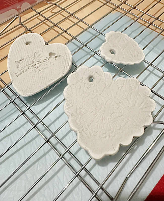 clay hearts with texture on drying rack