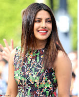 Priyanka Chopra looks super cute in happy mood wearing a short flower print dress in Hollywood 002.jpg