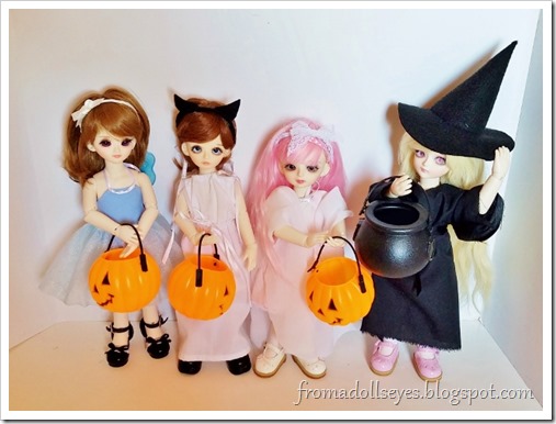 Four yosd sized ball jointed dolls all dressed in their Halloween costumes. A fairy, a cat, a ghost, and a witch. They are carrying cute pumpkin buckets and a plastic black cauldron for the witch costume. Four yosd sized ball jointed dolls all dressed in their Halloween costumes. A fairy, a cat, a ghost, and a witch. They are carrying cute pumpkin buckets and a plastic black cauldron for the witch costume.