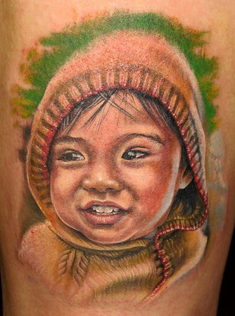 Cute kid with hood tattoo
