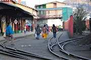 THE TOY TRAIN RAIL SHARE THE SAME ROAD. (dsc )