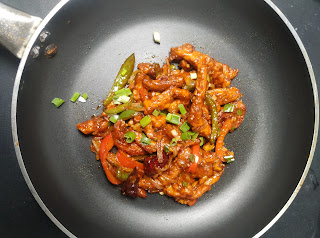 Cooked dragon chicken in a frying pan