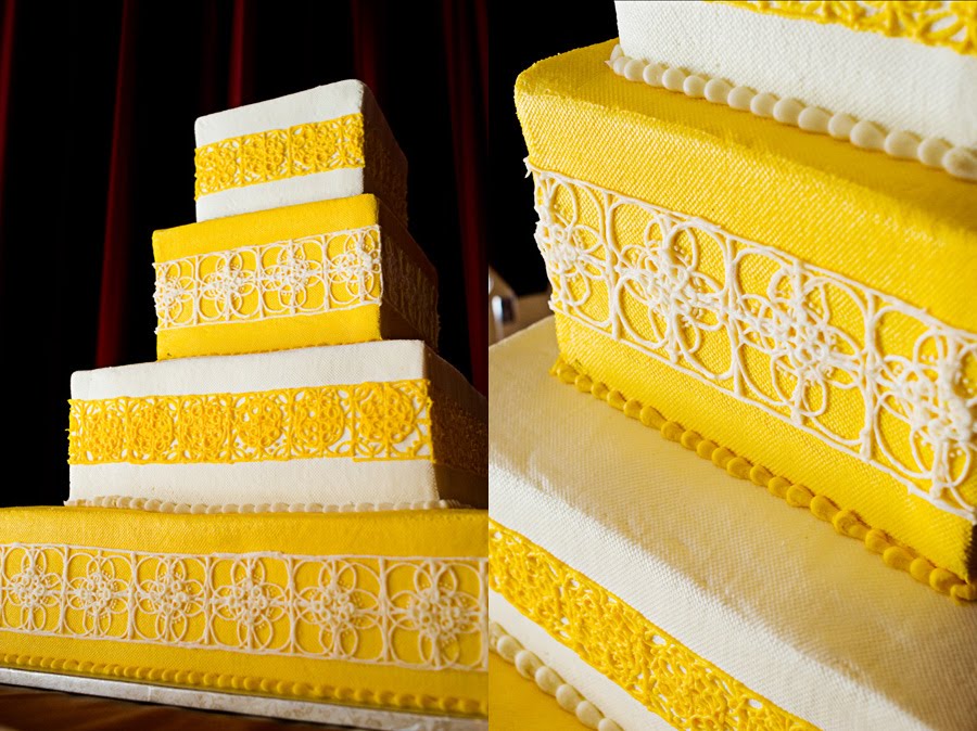 Square four tier wedding cake in white and bright yellow