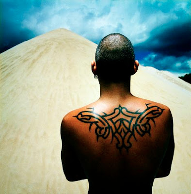 Tribal Tattoo A Latino man with back tribal tattoo