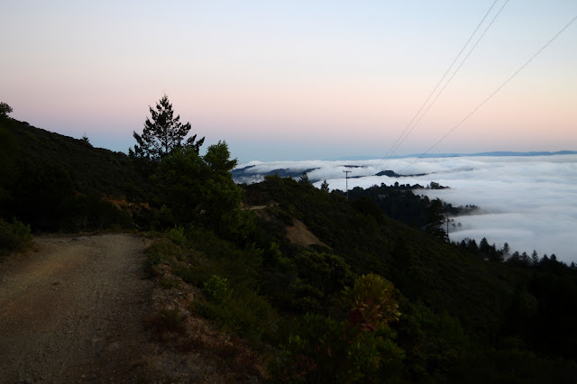 fog cresting the ridge line below