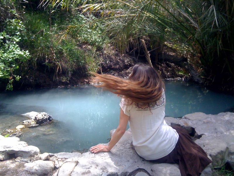 Natural aqua blue hot springs in a beautiful canyon less than a mile off