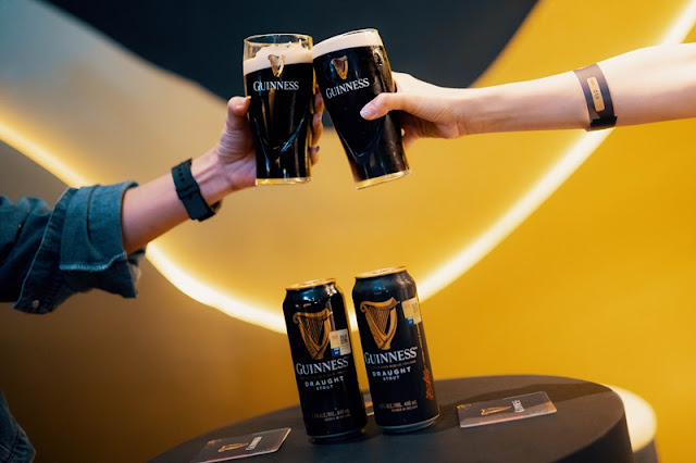 Guests cheers to smooth and creamy Guinness Draught in a Can