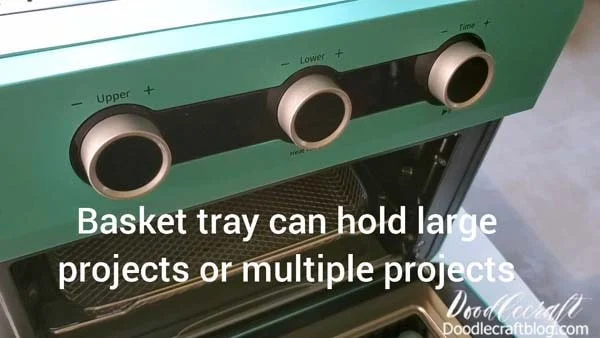 The basket tray inside the oven can hold larger objects (like a dog food bowl or big tumblers) or it can hold multiple projects.   These should be identical blanks, since each blank has a different temperature and time for processing.    But if you are making matching tumblers for your daughter's sports ball team, this is a fast way to do it.