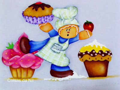  boneco Ginger com mufins e cupcakes