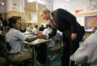 President George W. Bush meets students in the seventh grade science class at Harlem Village Academy Charter School in New York, during his visit to the school Tuesday, April 24, 2007, where President Bush spoke about his 'No Child Left Behind' reauthorization proposals. White House photo by Eric Draper.