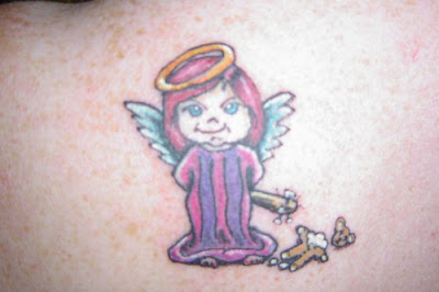 Cute Angel Tattoos,tattoo designs,angel tattoos,tattoos pics,tattoos designs,angel pictures,tattoos gallery,tattoos images,tattoos ideas,angel tattoo designs