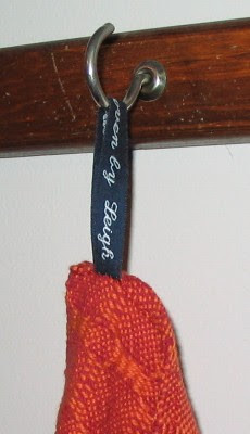 Close up of the label as a loop for hanging.