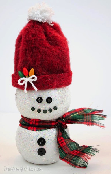 Plastic bottle snowman with santa hat