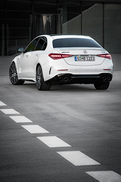 2023 Mercedes-AMG C 43 Sedan - rear and left side view - vertical.