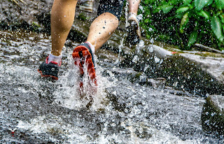 Feet running through water