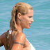 Enjoy the pictures of Michelle Hunziker showering on the beach in Varigotti 