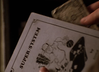 Mike McDermott retrieves money from a copy of 'Super/System' in 'Rounders'