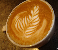 A latte with rosetta latte art