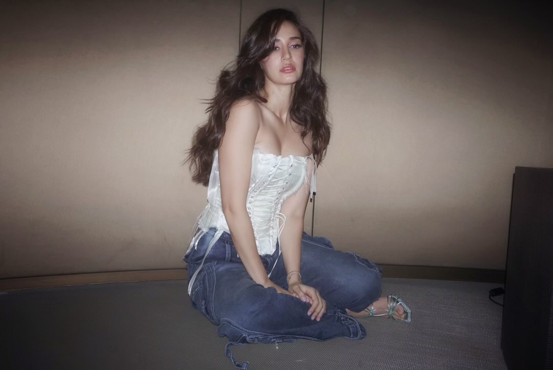 Disha Patani looks stunning in white top and denim jeans