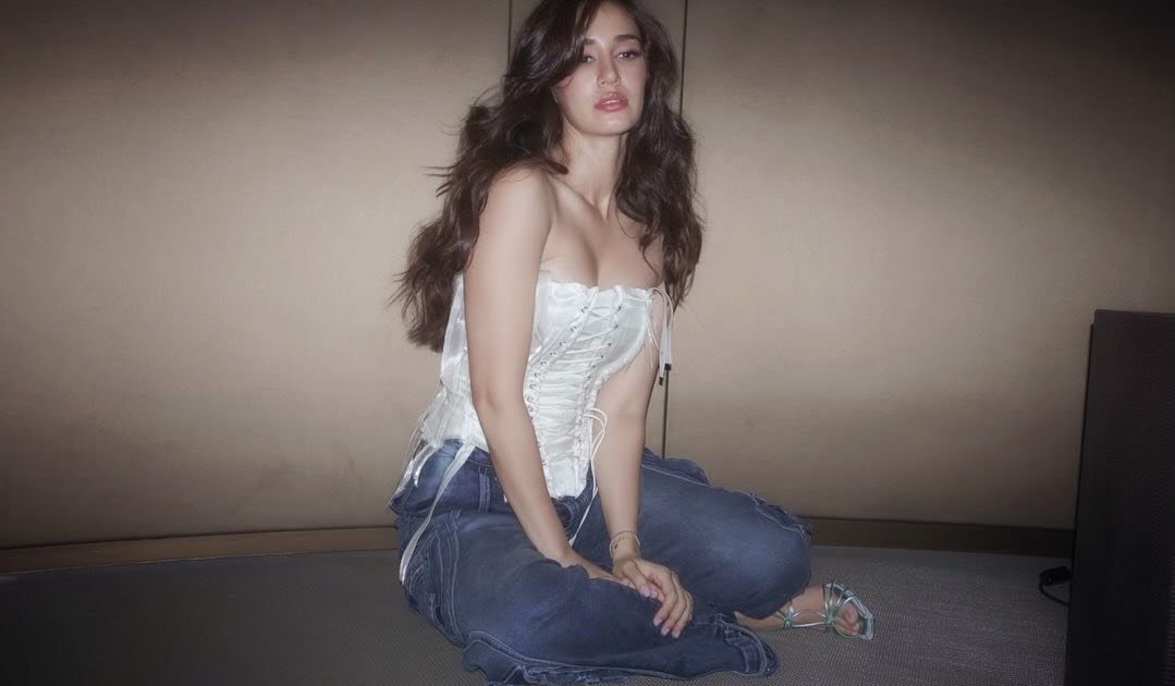 Disha Patani Stuns in Chic White Top and Denim Jeans, Reinforcing her Status as a Style Icon