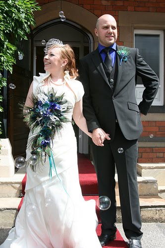 You can see the whole story behind this peacockthemed wedding at 