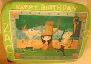 Cartoon cake. Raspberry and chocolate birthday cake for a 7year old.