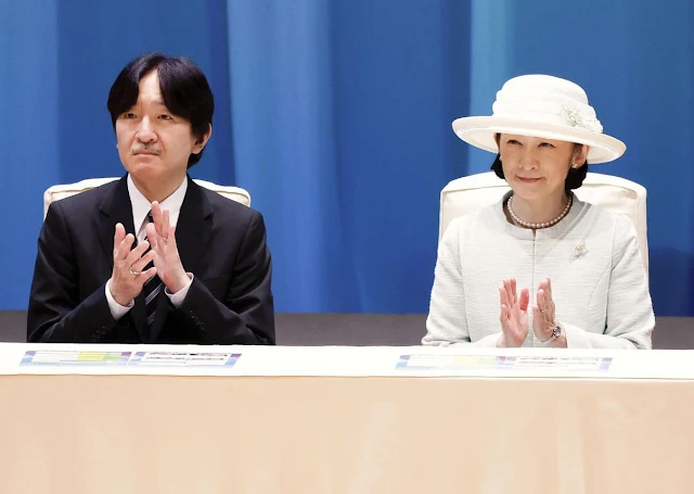 Crown Princess Kiko wore a light blue tweed jacket and skirt. The Toto Museum in Kita-Kyushu