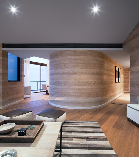 Photo of round wooden wall in the hallway of the penthouse