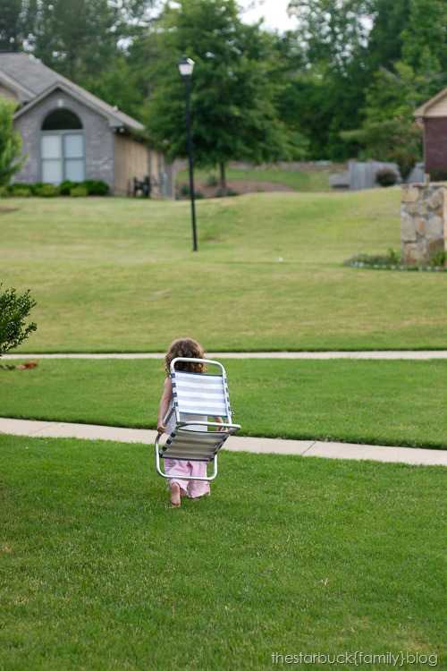 Abby playing with lawn chair and in carport blog-7