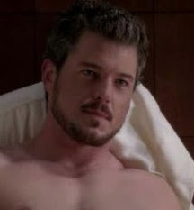 eric dane showing some flesh/with beard + mustache