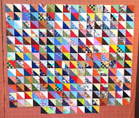 Scrappy half square triangle quilt