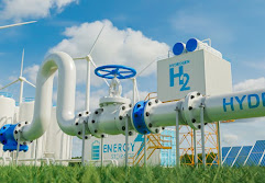 3D rendering image of a hydrogen production plant.  In the foreground is a large green sphere with "HYDROGEN" and "H₂" written on it. Other buildings and structures of the plant are located behind the bullet.