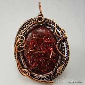 Handmade wire wrapped copper pendant with red orgonite cabochon. ©2014 Tim Whetsel