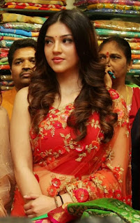 Mehreen Pirzada in Red Saree with Cute Expressions at Shopping Mall Opening