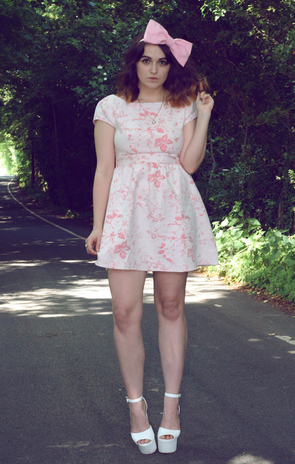 uk fashion style, dahlia fashion tapestry floral Jacquard dress styled with pink bow, vintage opal gold necklace, white platform wedges and a huge pink hair bow from roses and clementines, a tea party look, inspired by alice in wonderland, through the looking glass