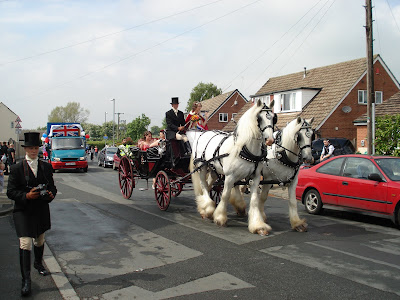 Shire horses pulling a cart in the Gawthorpe Mayday Parade