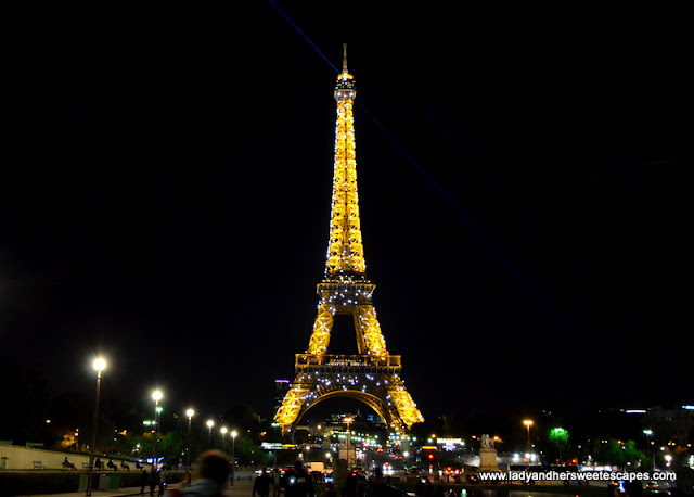 Eiffel Tower sparkles at night