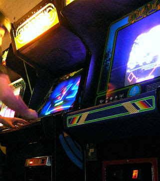 Retro Remakes 2008 Competition. Image of arcade games Berzerk and Centipede glowing brightly.