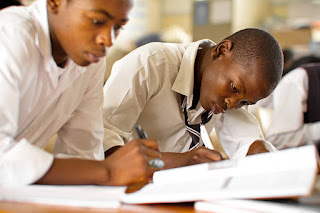 Two students writing essay competition 